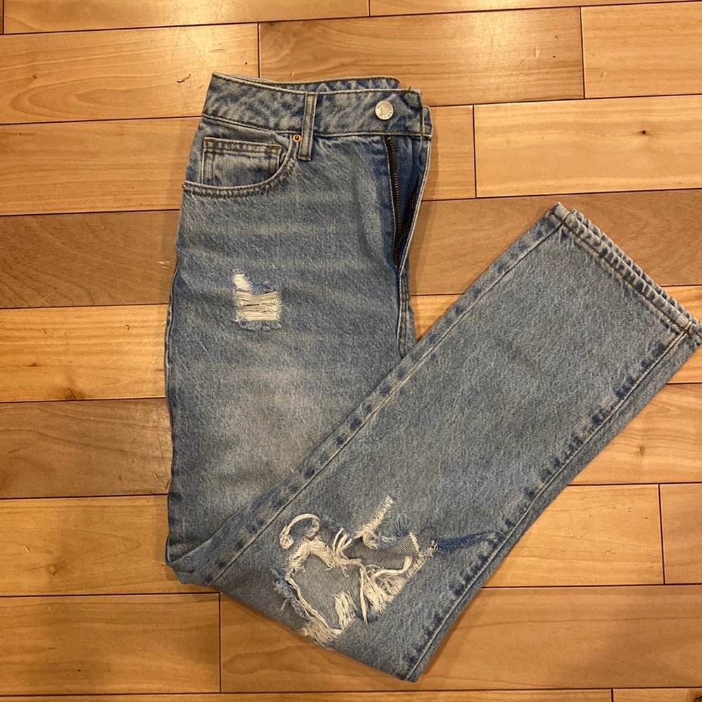 Ripped blue High Rise jeans.